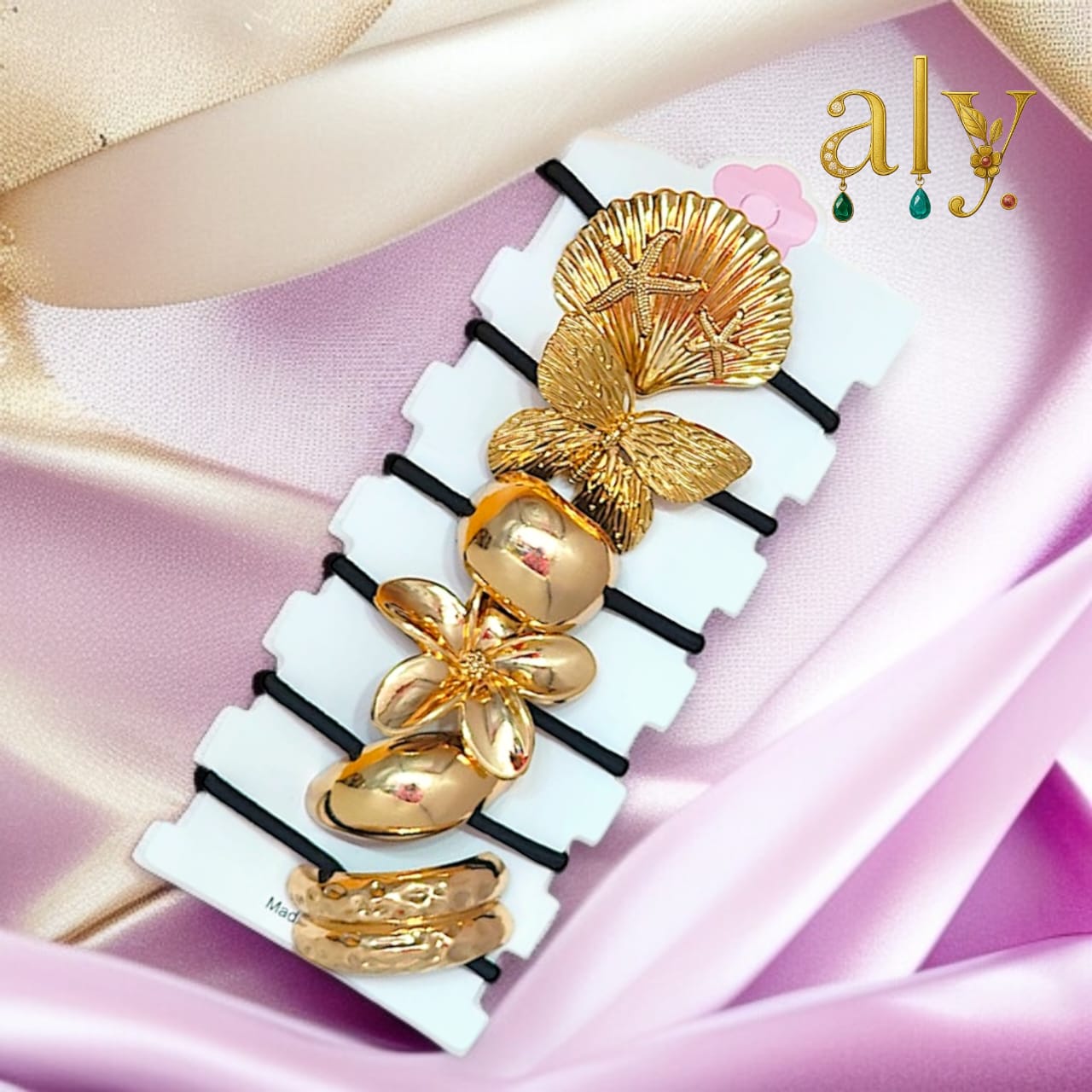 Gold-toned crescent accent.