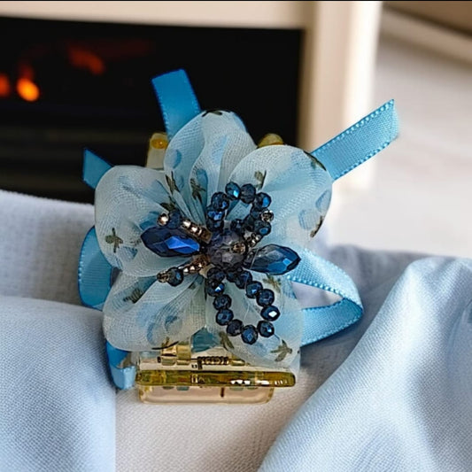 Floral ribbon and beaded embellishments.